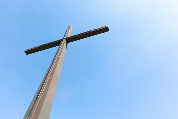 Big metal cross and a clear sky -the concept of religion