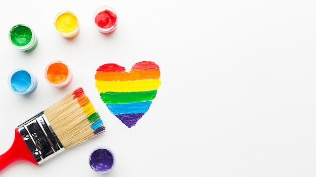 big paint brush and rainbow heart copy space