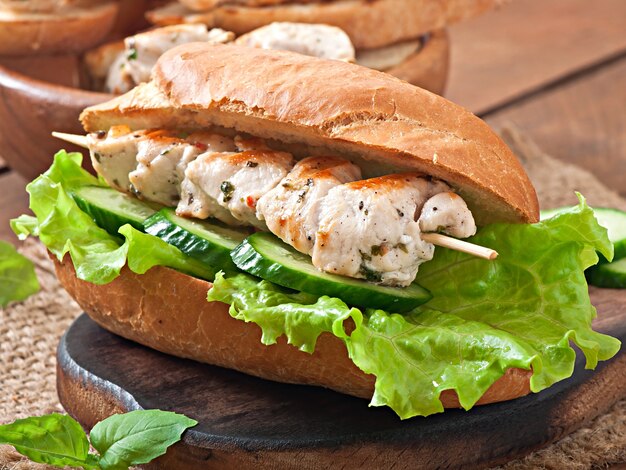 Big sandwich with chicken kebab and lettuce