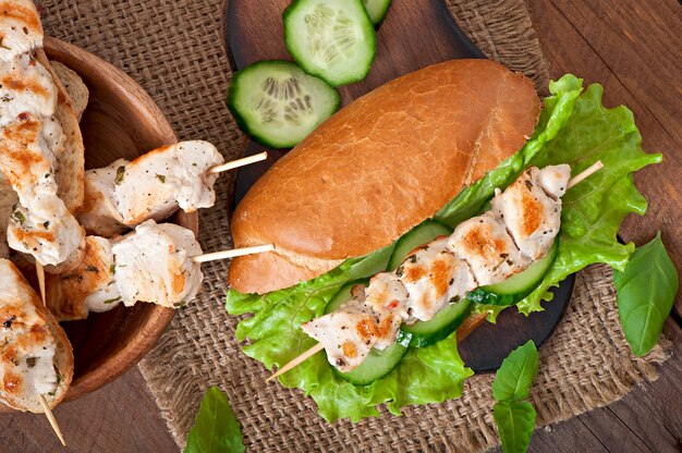 Big sandwich with chicken kebab and lettuce