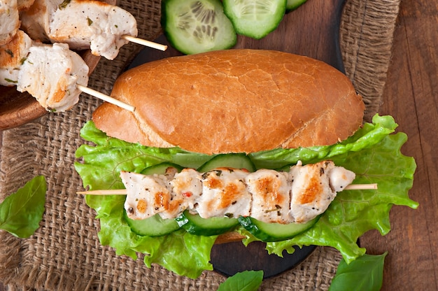 Big sandwich with chicken kebab and lettuce