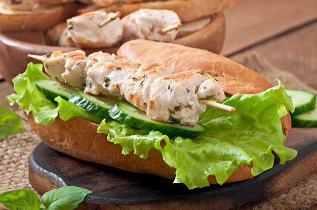 Big sandwich with chicken kebab and lettuce