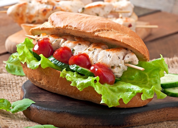 Big sandwich with chicken kebab and lettuce