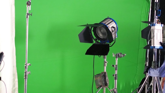Big studio led spotlight for video movie or photo film production with green screen background