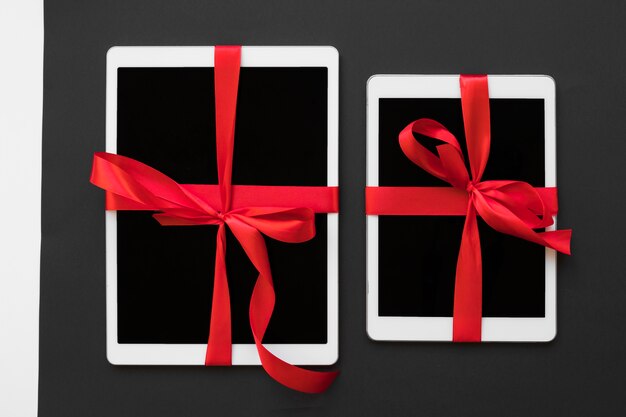 Big tablets with red ribbons