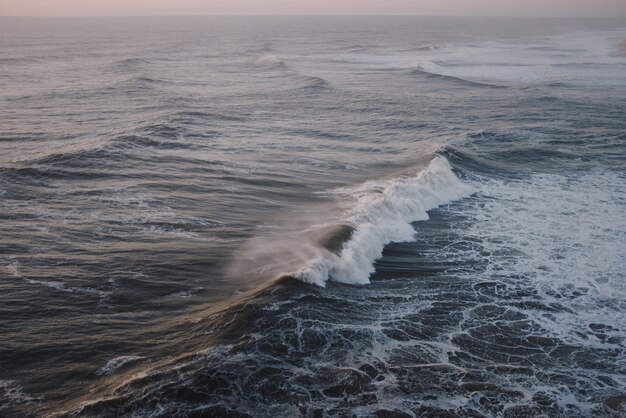 Big wave breaking at sunset