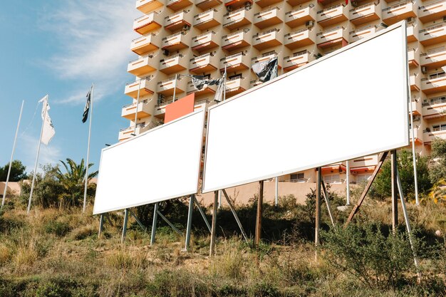 Big white advertising screen in city