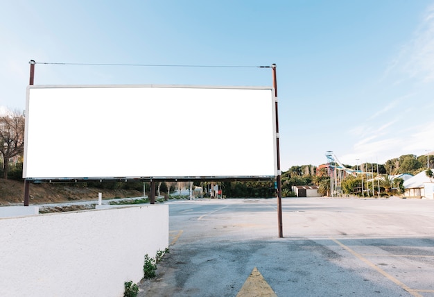 Big white billboard on city parking