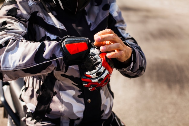 Biker checking his gear before ride