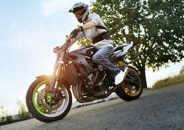 Free photo biker riding motorcycle