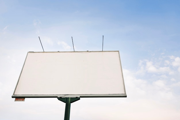 Billboard on background of cloudy sky