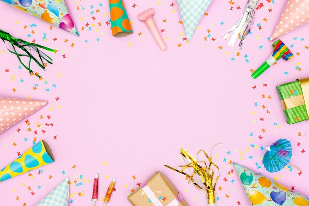 Birthday accessories frame on pink background