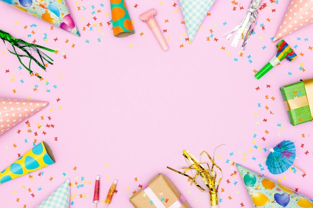 Birthday accessories frame on pink background