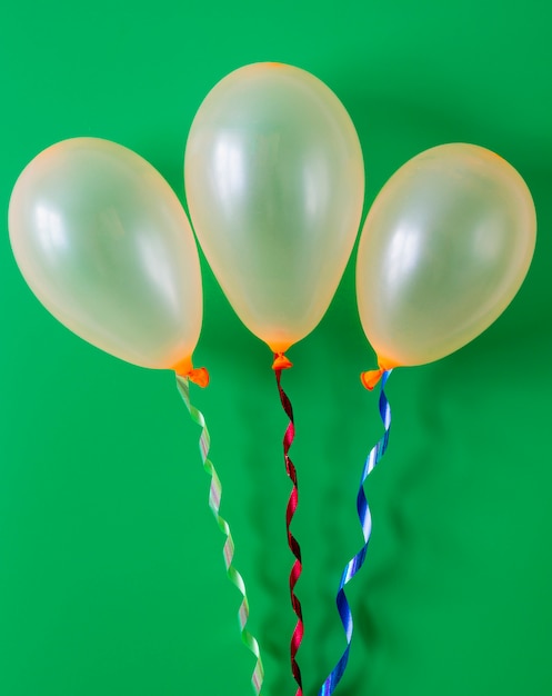 Birthday balloon on green background