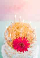 Free photo birthday cake in front of watercolor background