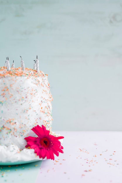 Birthday cake in front of watercolor background