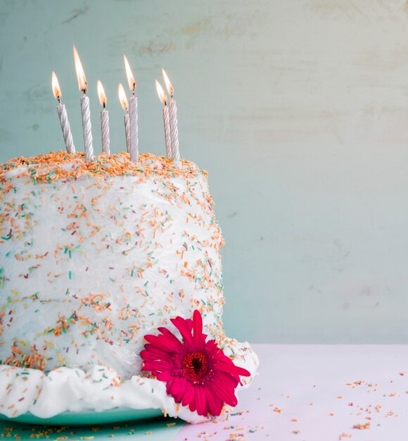 Birthday cake in front of watercolor background