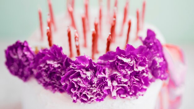 Birthday cake in front of watercolor background