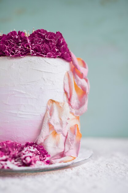 Birthday cake in front of watercolor background