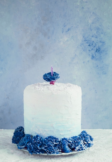 Birthday cake in front of watercolor background