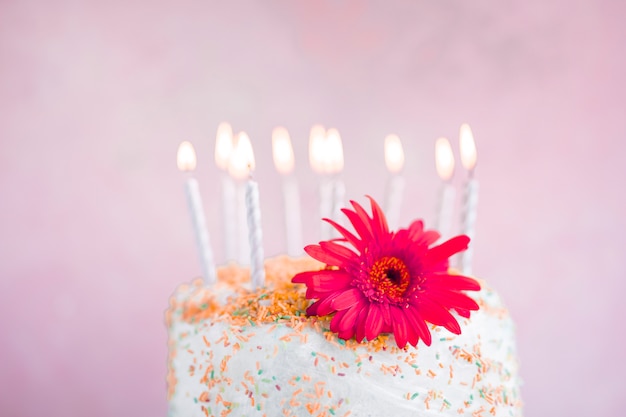 Free photo birthday cake in front of watercolor background