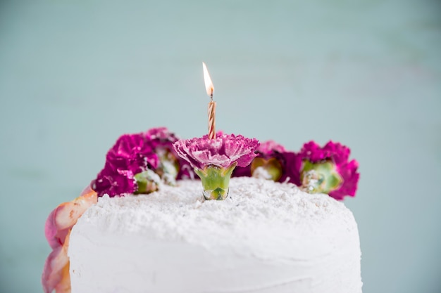 Birthday cake in front of watercolor background