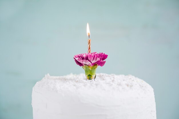 Birthday cake in front of watercolor background