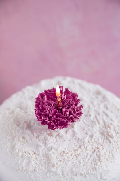 Birthday cake in front of watercolor background