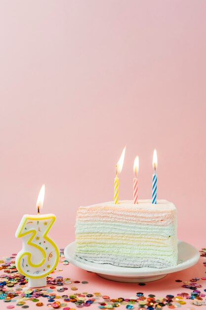 Birthday cake with lit candles