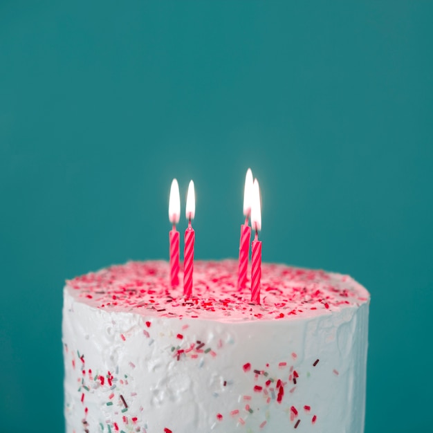 Birthday cake with lit candles