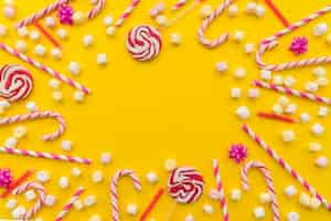 Free photo birthday candy on yellow background
