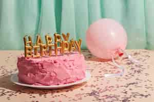 Free photo birthday concept with cake and balloon