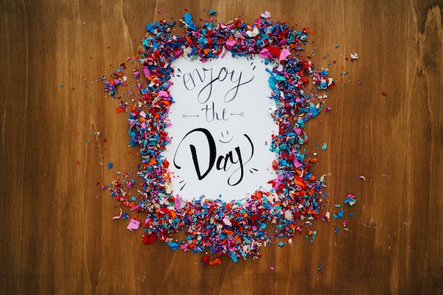 Birthday concept with paper framed by confetti