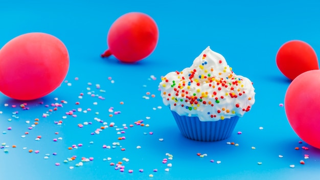 Birthday cupcake with balloons