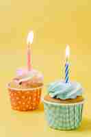 Free photo birthday cupcake with lit candle