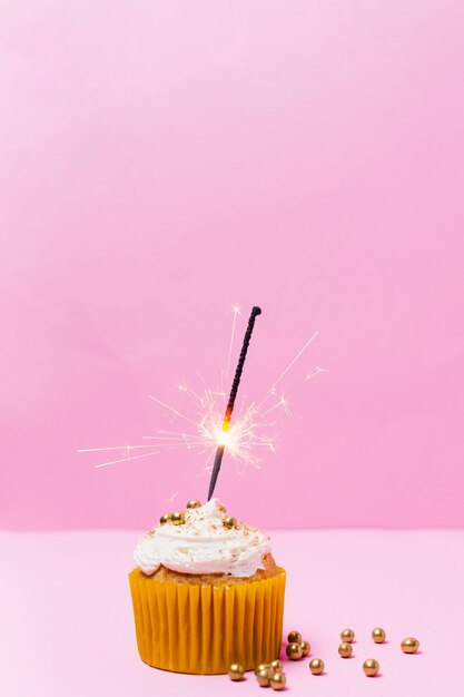 Birthday cupcake with pink background