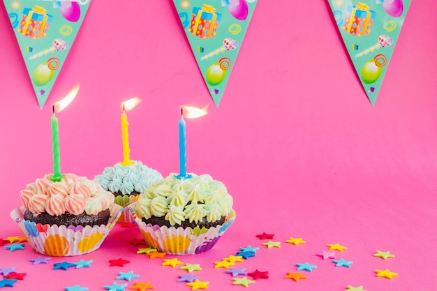 Free photo birthday cupcakes with candles