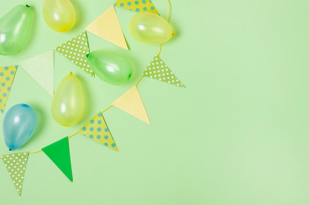 Birthday decoration on green background with copy space