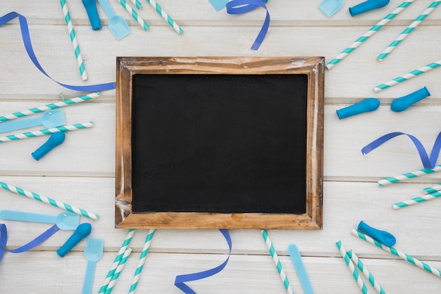 Birthday decoration with slate and blue party objects