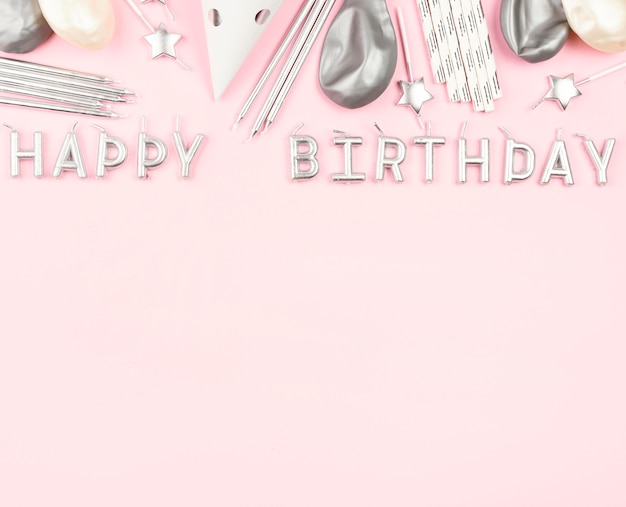 Birthday decorations on pink background