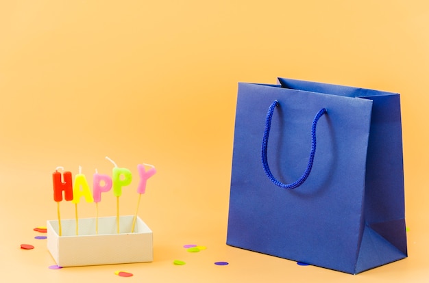 Free photo birthday gift bag with candles