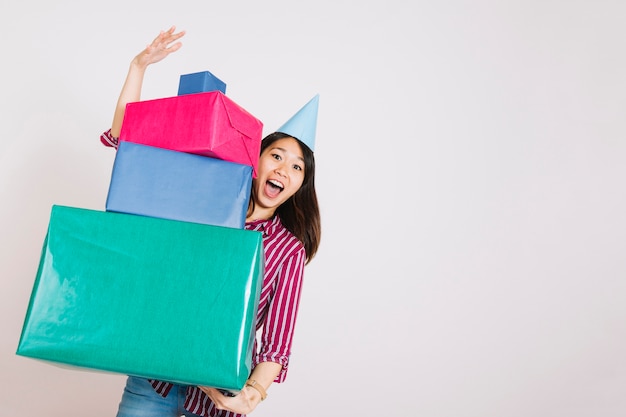 Birthday girl with three gift boxes