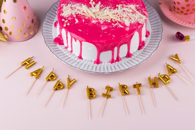 birthday party items and cake high angle