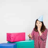 Free photo birthday woman with present boxes