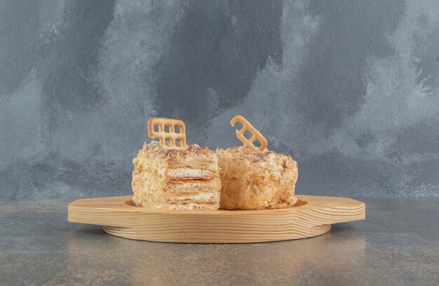 Biscuit topping on cake slices on a wooden platter 