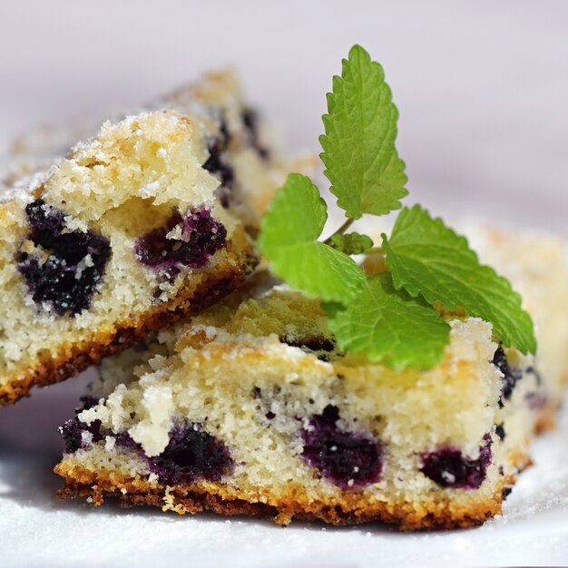 "Biscuit with berries served on plate"