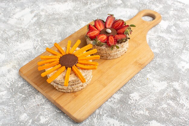 biscuit with strawberries on wooden desk