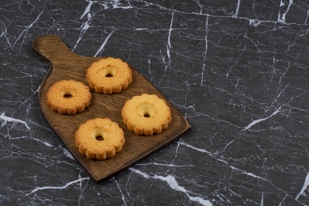 Biscuits on the cutting board, on the marble surface