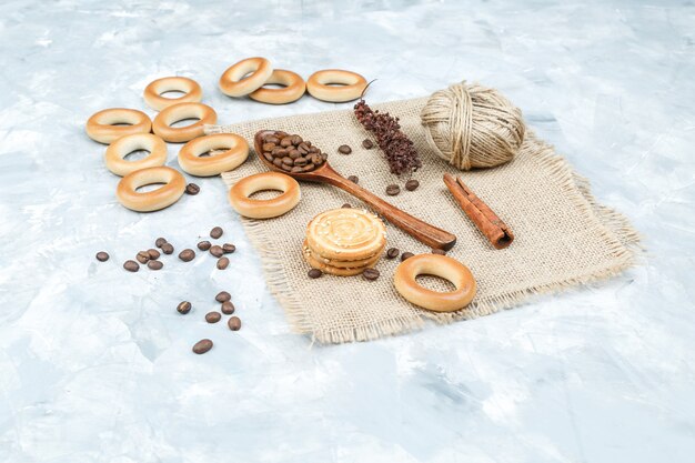 Biscuits with coffee beans on grungy background