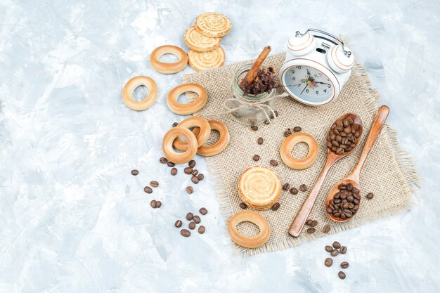 Biscuits with coffee beans on grungy background